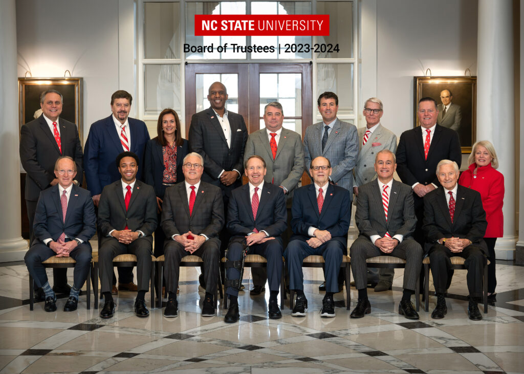 A group photo of the NC State University Board of Trustees and Chancellor Woodson.
