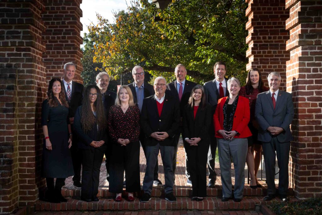 Members of the 2024-2025 Chancellor's Cabinet stand on the steps of Holladay Hall.